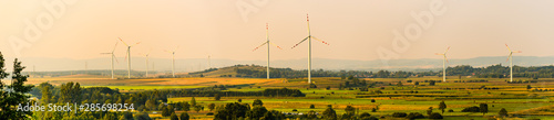 Panorama landscape, Wind turbines on the field in rural area photo