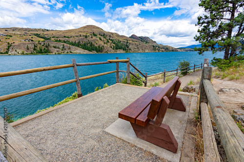View of a park bench at Kalamalka Lake from Kalamalka Lake Provincial Park near Vernon British Columbia Canada