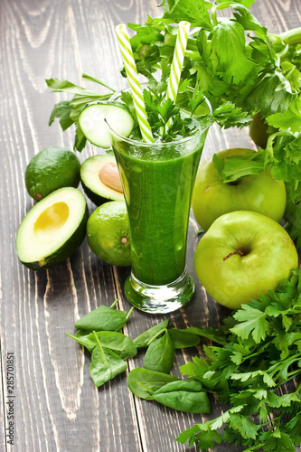 Glass of healthy celery smoothie with green apple, cucumber a healthy drink for detox