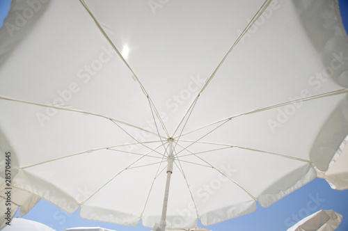 Wide angle view of beach umbrella sunny day