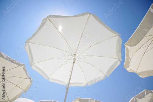Wide angle view of beach umbrella sunny day