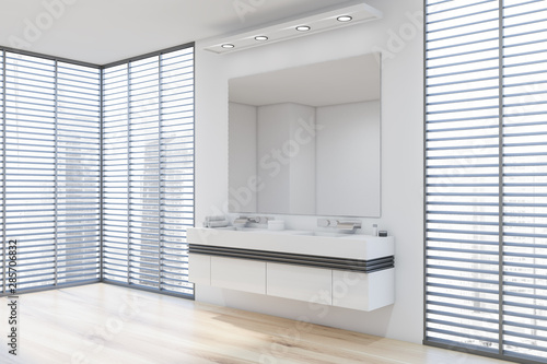 White bathroom corner with double sink and blinds