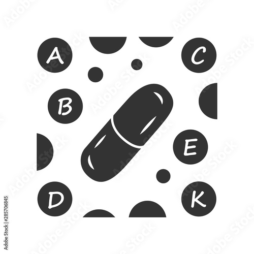 Vitamin pills glyph icon. A, B, C, D, E, K multi vitamins complex. Multivitamin medication. Vital minerals and antioxidants. Silhouette symbol. Negative space. Vector isolated illustration