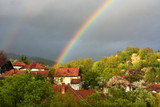 a rainbow above the village