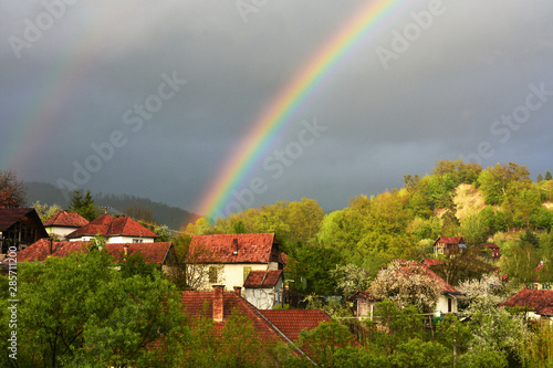 a rainbow above the village