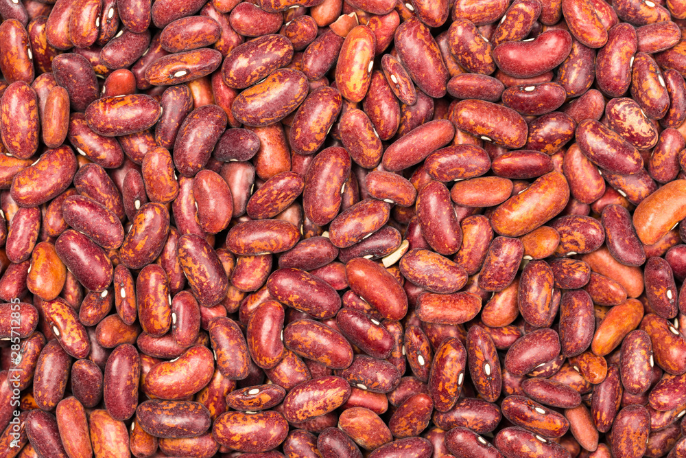 Red kidney bean texture background. Also called Rajma or Mexican Bean. A large, kidney-shaped bean with a subtle sweet flavor and soft texture that keep their shape during cooking. Red kidney bean texture background. Also called Rajma or Mexican Bean. A large, kidney-shaped bean with a subtle sweet flavor and soft texture that keep their shape during cooking.