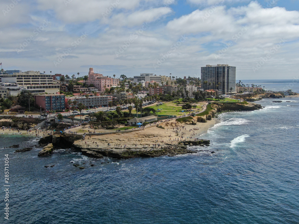 Aerial view of La Jolla Cove, small picturesque cove and beach surrounded by cliffs, San Diego, California. Protected marine reserve, popular with snorkelers and swimmers. Travel destination.