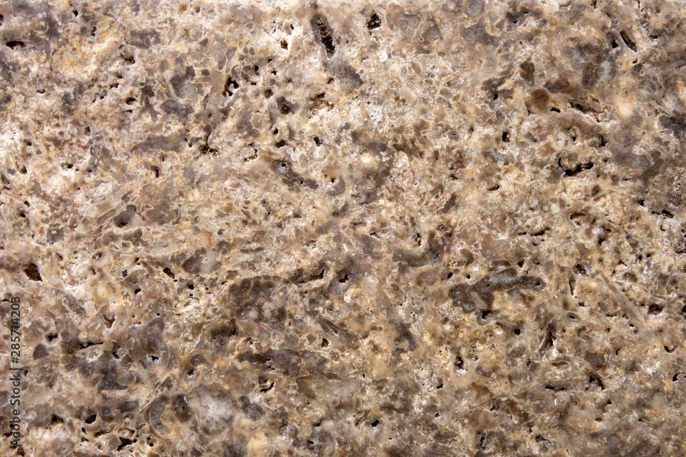 The structure of natural stone. Sand stone. Creative vintage background. Brown natural workpiece. The structure of natural stone. Sand stone. Creative vintage background. Brown natural workpiece.