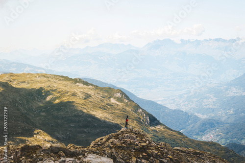 Scenic Alps mountain panorama. Journey Travel Trek and real life concept. Tourism idea with copy space. Beautiful nature. Rest in the mountains. Autumn in Alps in green and white colors