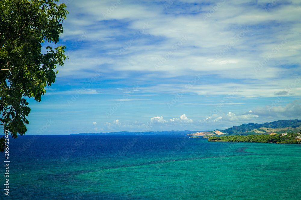 Fototapeta premium Aerial view from the drone on the beautiful landscape of tropical beach with turquoise sea. Summer vacation consept.