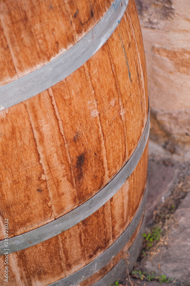 Closeup of wooden barrel of vine for decoration in the street typical village Closeup of wooden barrel of vine for decoration in the street typical village