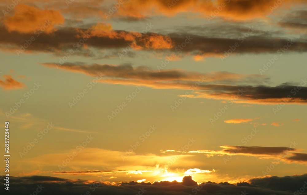 Beautiful yellow golden sunset background over the city