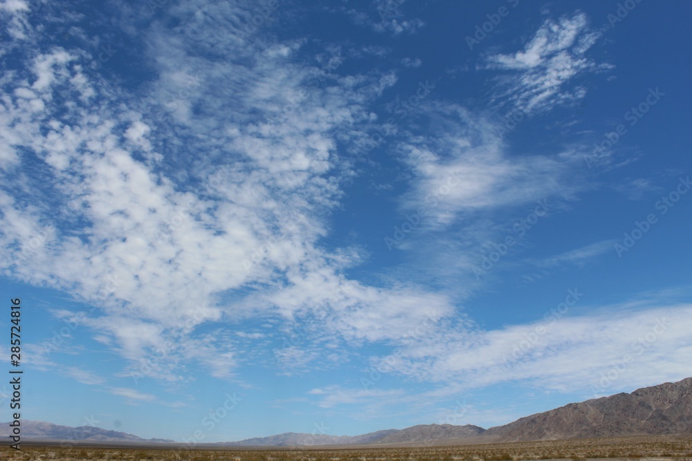 Cloud patterns over the Bullion Mountains in Cleghorn Lakes Wilderness of the Southern Mojave Desert.