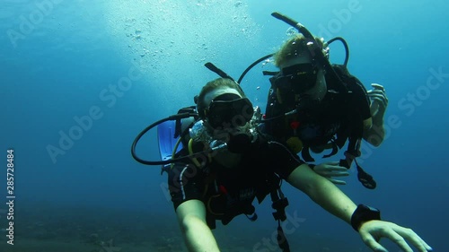 Wallpaper Mural Happy Scuba Diving Couple Waving to Camera in Crystal Clear Blue Ocean Water Torontodigital.ca