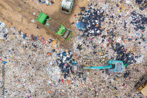 Garbage or waste Mountain or landfill, Aerial view garbage trucks unload garbage to a landfill. Plastic pollution crisis.