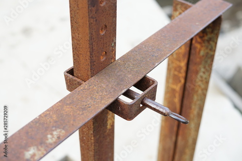 Rusty iron key of dam gate control for irrigated rice field
