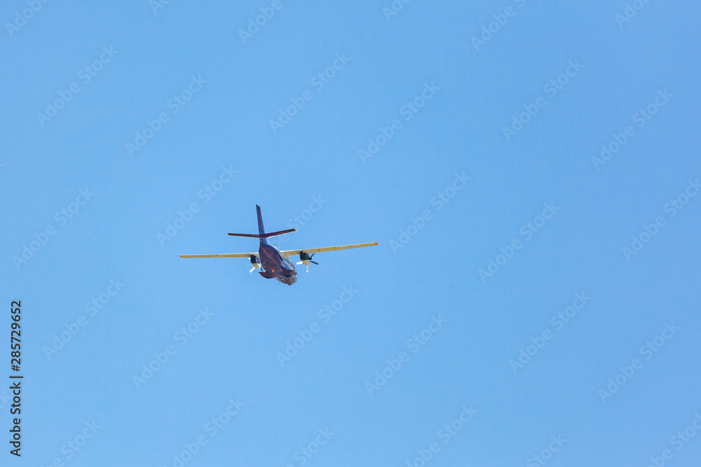 Flying airplane on a blue sky. Flying over Svaneti, Georgia.