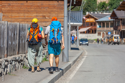 Traveling tourists with backpacks in Mestia, Svaneti, Georgia. © k_samurkas