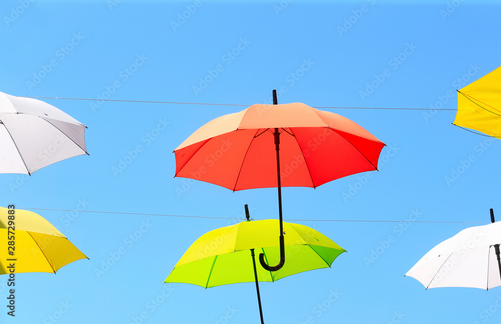 Colorful umbrellas against the blue sky