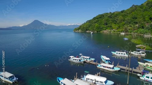 Aerial over Lake Amatitlan in Guatemala reveals the Pacaya Volcano. photo