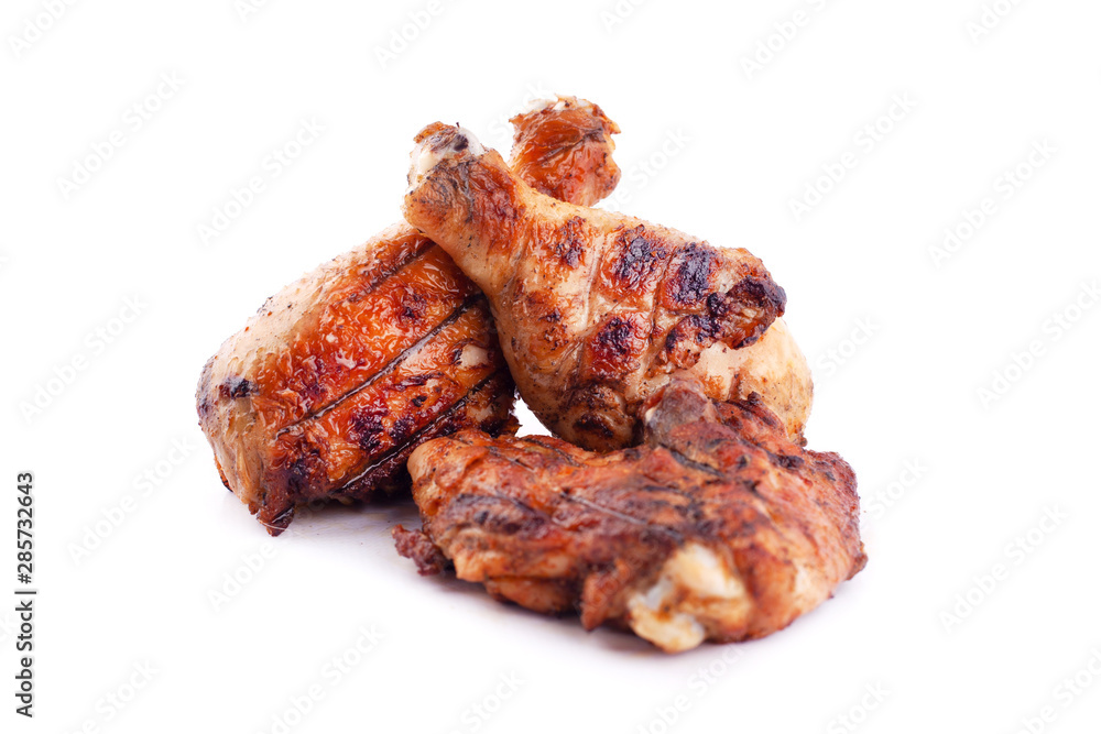 baked chicken legs on a hot grill on a white background,fast fried food,logo chicken thighs isolated baked chicken legs on a hot grill on a white background,fast fried food,logo chicken thighs isolated