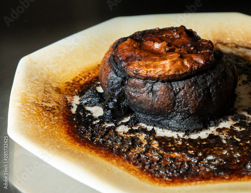 Pastry meat pie completely charred and burned after leaving in the microwave oven too long photo