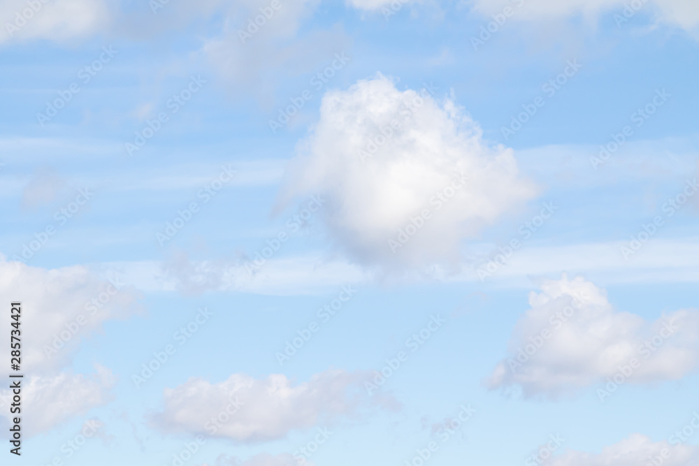 White clouds in the blue sky, day. Wallpaper.