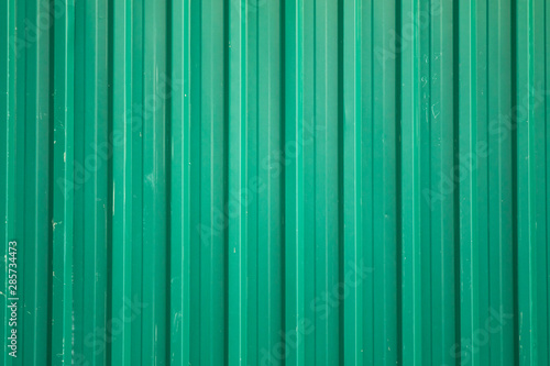 Metal corrugated fence green old.