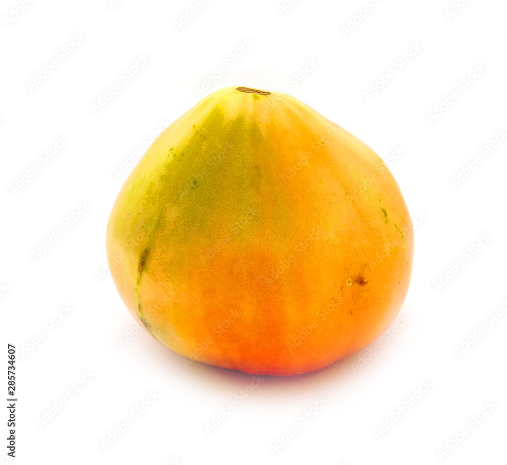 Ripe ugly tomato on a white background. Ripe ugly tomato on a white background.