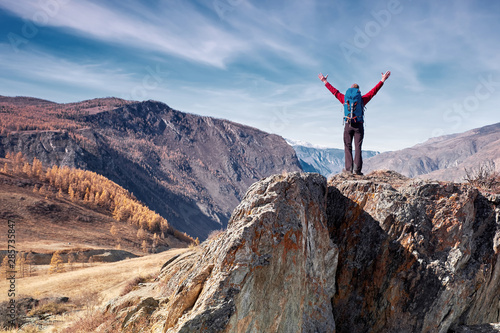 Man with backpack hiking in mountains. Travel Lifestyle success concept adventure active vacations outdoor mountaineering sport © Joe-L