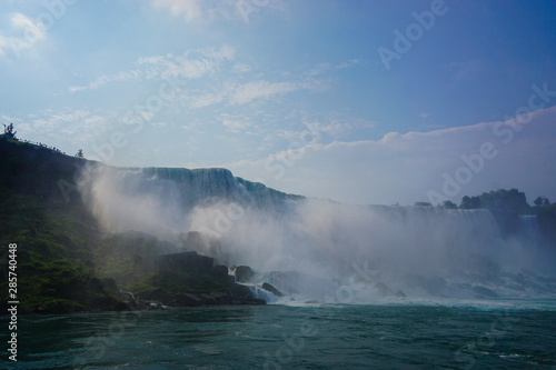 Niagara Falls  NY  Sprays of mist rising from the American Falls  viewed from the deck of a tour boat in the Niagara Gorge.