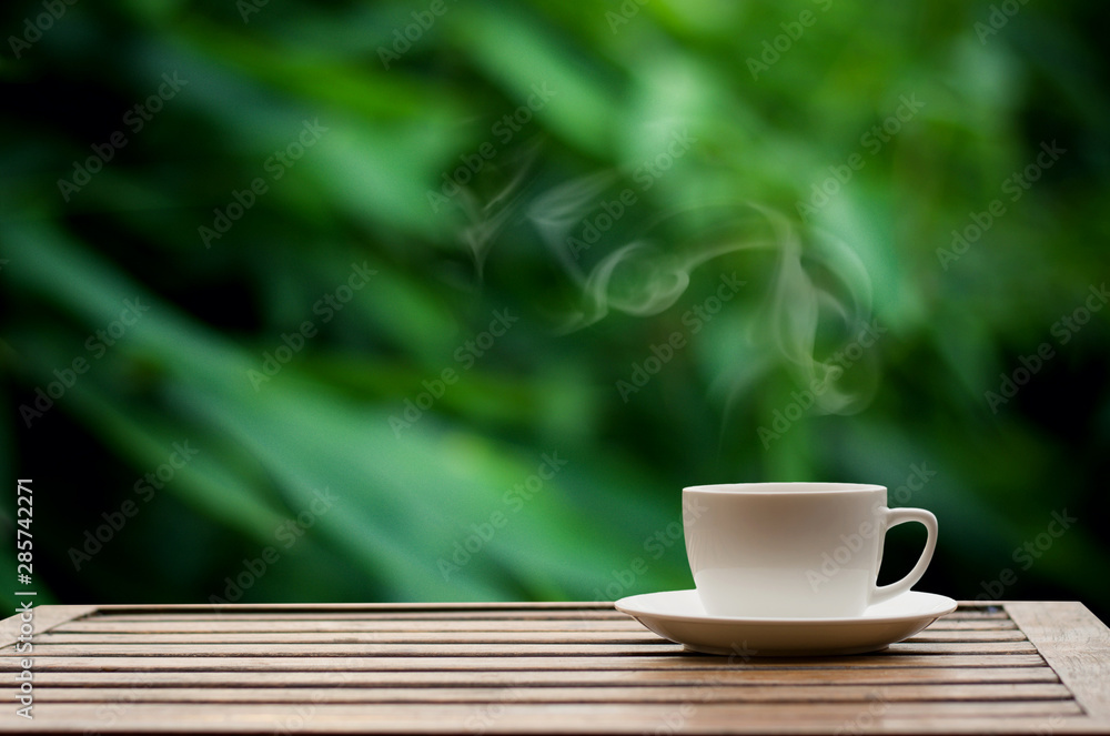 Coffee espresso on wood table nature background in garden,warm tone Coffee espresso on wood table nature background in garden,warm tone