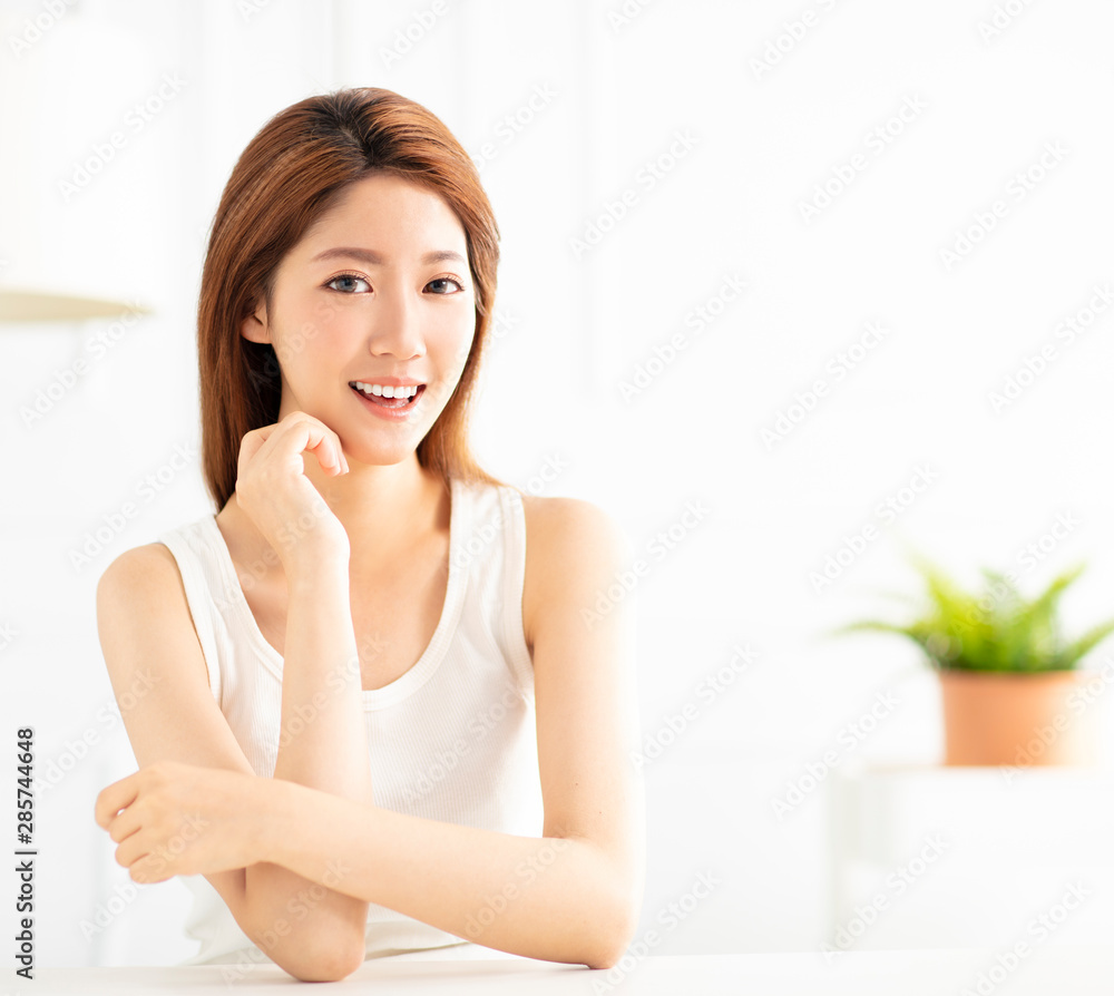 closeup smiling young asian woman in living room closeup smiling young asian woman in living room