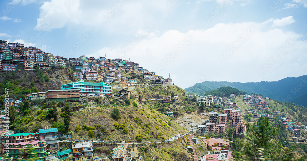 Aerial view of residential neighborhood built on a hill on a sunny day, shimla, himachal pradesh, india