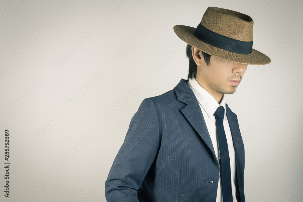 Young Asian Portrait Businessman Wear Hat in Zoom View in Vintage Tone Young Asian Portrait Businessman Wear Hat in Zoom View in Vintage Tone