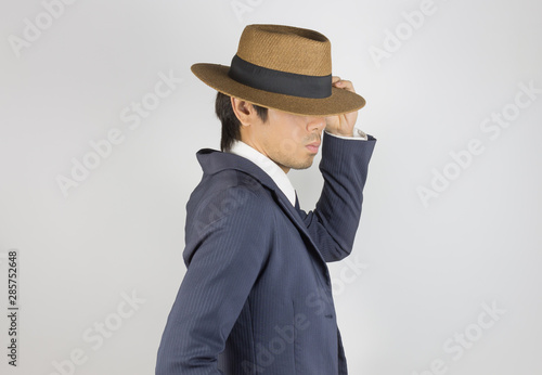 Young Asian Portrait Businessman Touch Hat Brim at Side View © steafpong