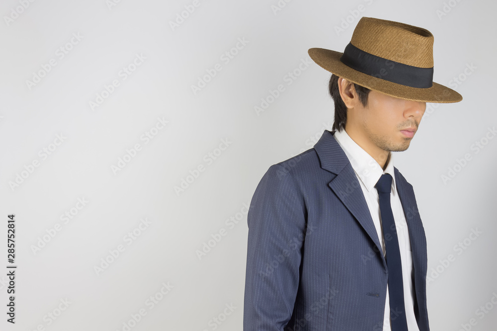 Young Asian Portrait Businessman in Navy Blue Suit Wear Hat at Right Frame Young Asian Portrait Businessman in Navy Blue Suit Wear Hat at Right Frame