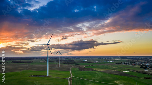 Wonderful wind turbines at sunset, view from above © shaiith