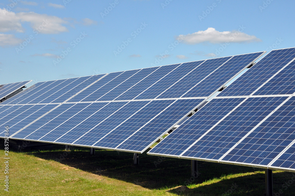 Solar panels and blue sky. Solar panels system power generators from sun. Solar panels and blue sky. Solar panels system power generators from sun.