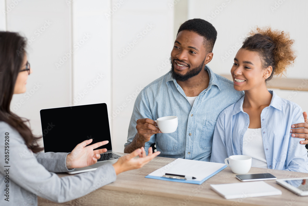Afro Couple Attending Home Buying Consultation In Real Estate Agency Afro Couple Attending Home Buying Consultation In Real Estate Agency