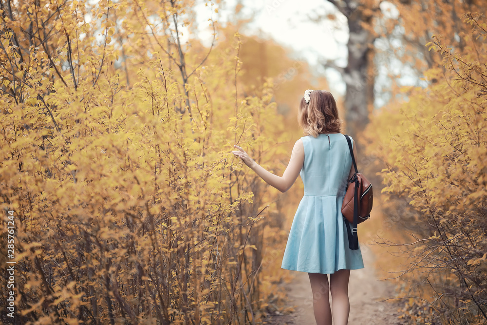 Young girl on a walk in the autumn Young girl on a walk in the autumn