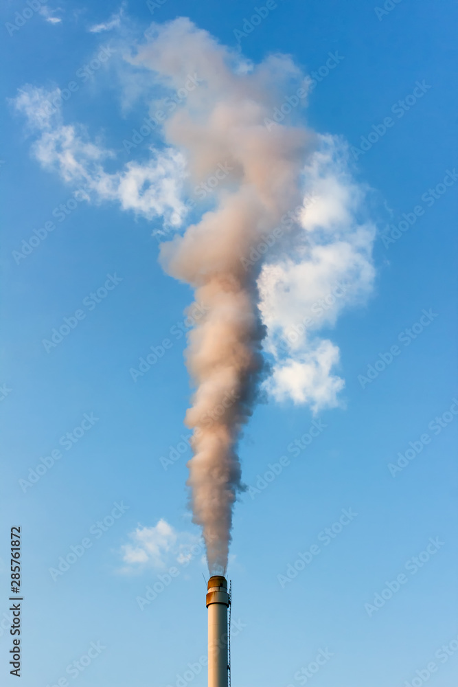 Vertical photo with a pipe emitting production factory fumes into the atmosphere. Vertical photo with a pipe emitting production factory fumes into the atmosphere.