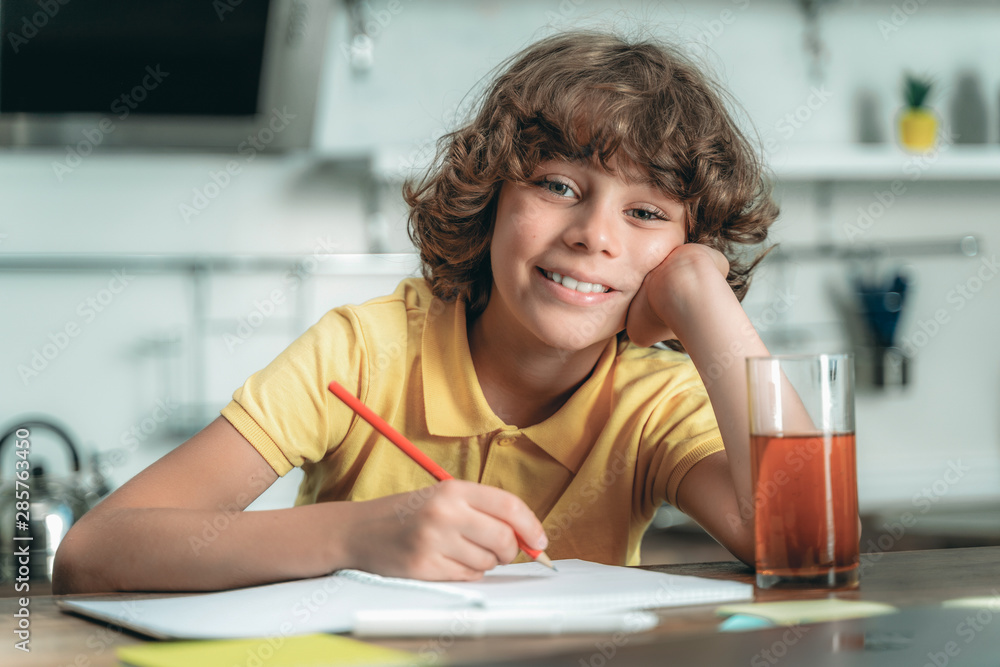 Little kid making school homework at home Little kid making school homework at home