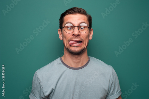 Portrait of a funny young man in glasses