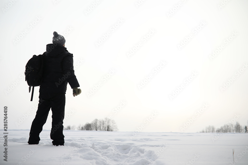 A man on a walk. Winter landscape. Tourist in winter journey. A man on a walk. Winter landscape. Tourist in winter journey.
