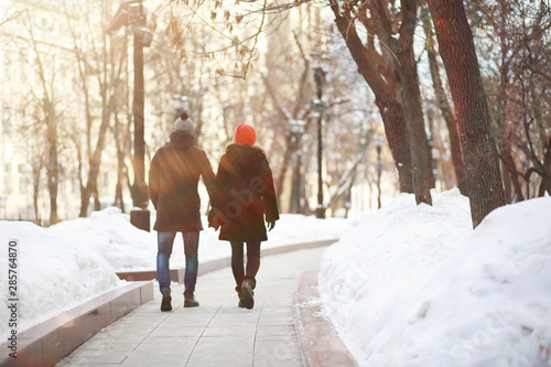 Young couple walking through the winter