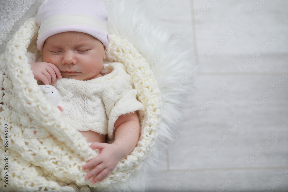 Baby newborn sleeping wrapped up in a blanket Baby newborn sleeping wrapped up in a blanket