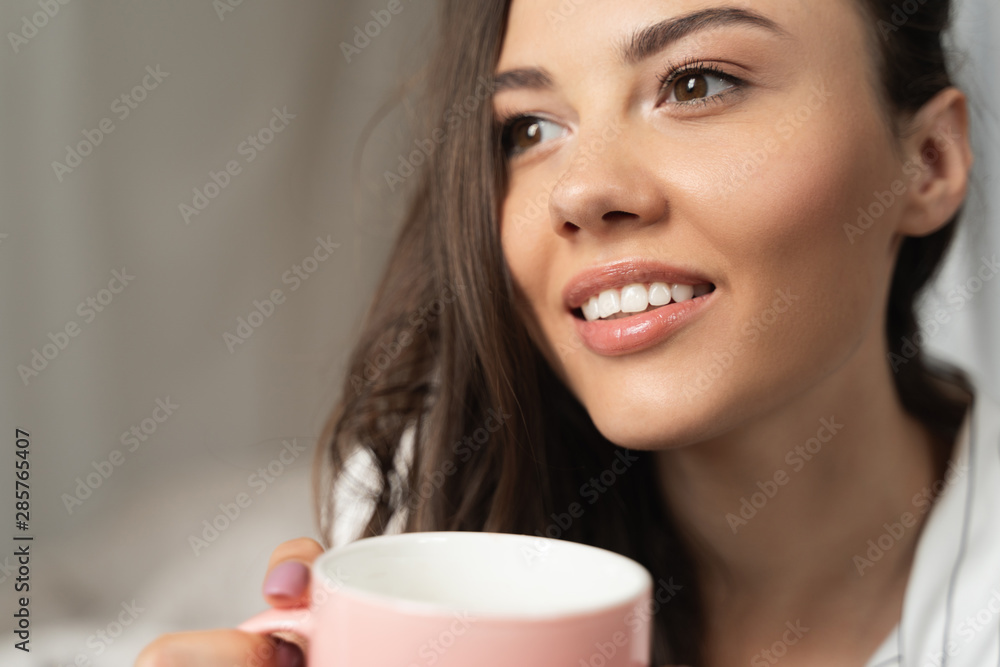 Beautiful young woman holding cup of coffee Beautiful young woman holding cup of coffee