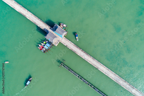 Aerial top view drone shot of bridge with long tail boats fisherman in summer season