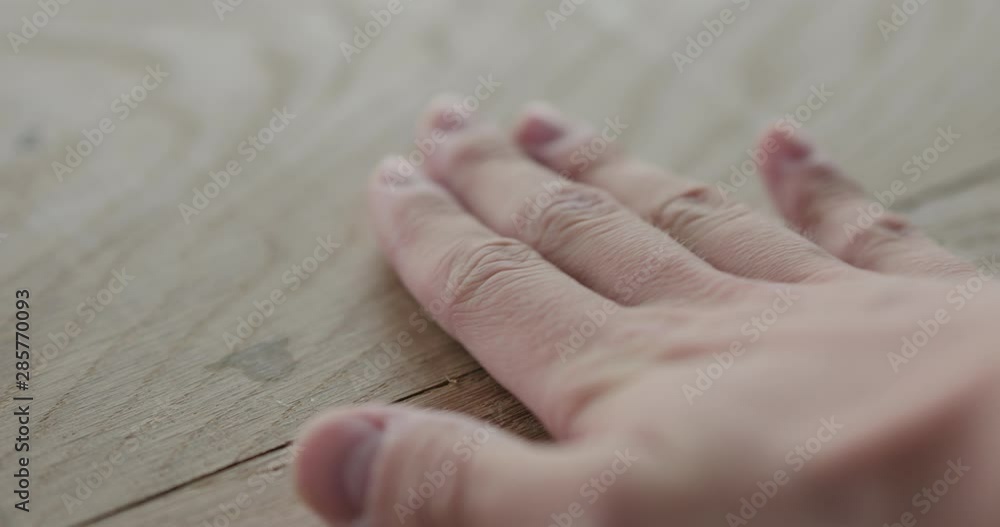 Slow motion man hand check quality of glued oak wood surface Slow motion man hand check quality of glued oak wood surface